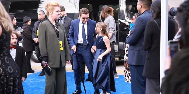 Jeremy Renner with Ava on the red carpet