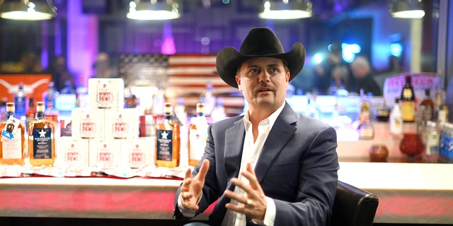 John Rich sits at his Nashville bar with his Redneck Riviera whiskey