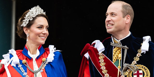 Kate Middleton wearing a fancy headpiece standing next to Prince William during the coronation