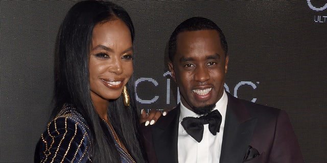 Kim Porter wears sparkling navy blue dress to Ciroc event with Puff Daddy