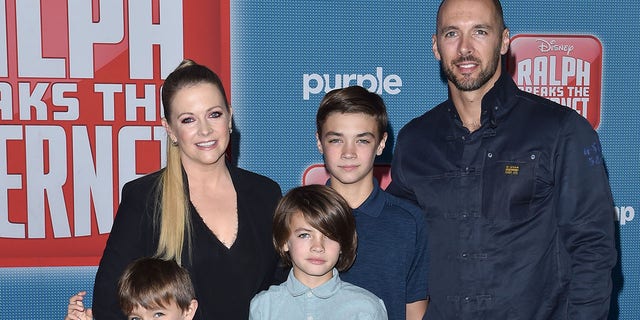 Melissa Joan Hart poses for a family photo with husband Mark Wilkerson and their children, Tucker, Braydon and Mason.