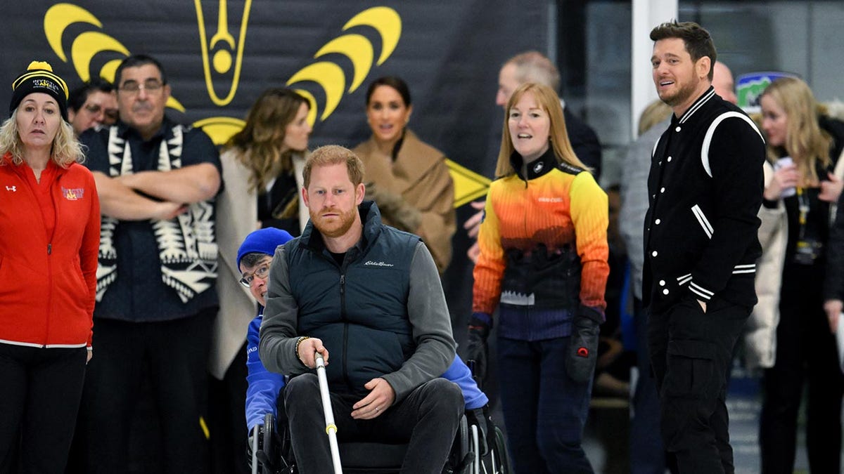 Prince Harry trying wheelchair curling with Michael Buble