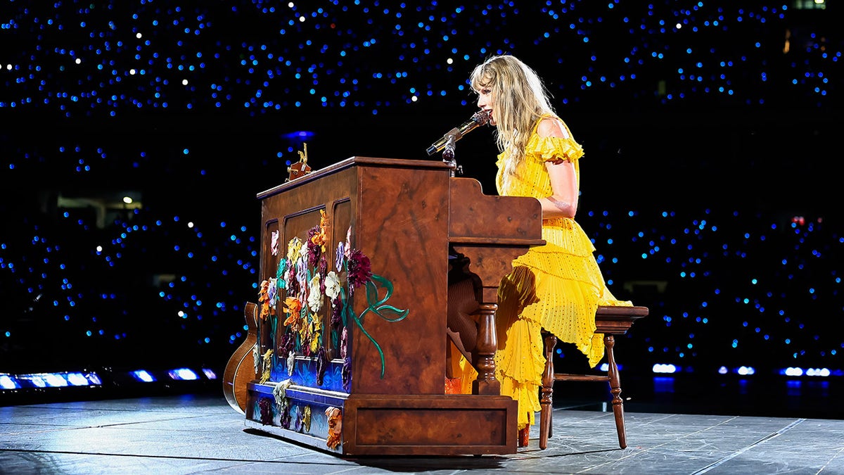 Taylor Swift wears yellow dress at the piano on Eras Tour